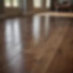 A pristine laminate hardwood floor reflecting natural light.