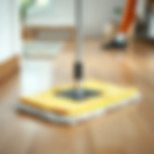 Mop with microfiber pad on laminate wood floor