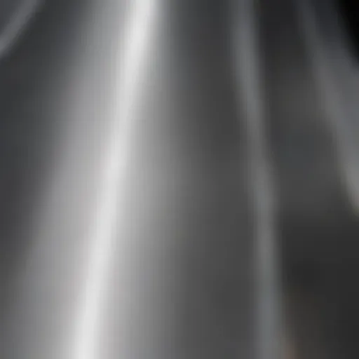Close-up view of a brushed stainless steel surface reflecting light