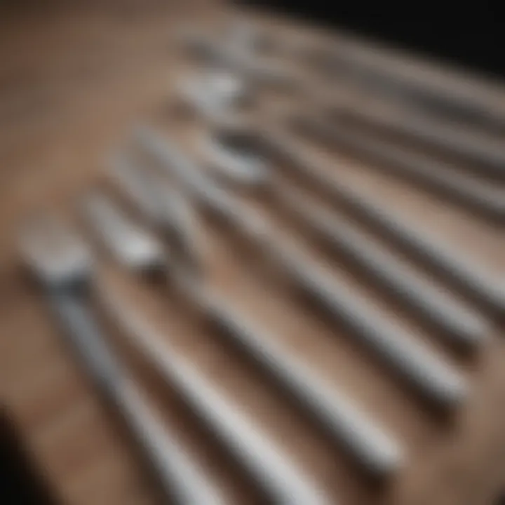 Close-up of polished cutlery arranged on a table