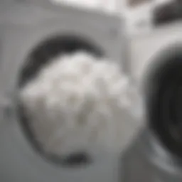 Close-up of a fluffy pillow being placed in a washing machine
